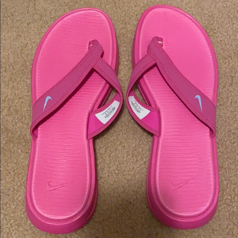 Pink flip-flops Nike brand foam and light weight
